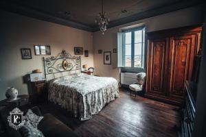 Postel nebo postele na pokoji v ubytování Palazzo Capparucci - Dimora storica + 111 fotografií