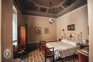Säng eller sängar i ett rum på Palazzo Capparucci - Dimora storica - Guest House