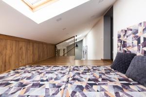 Кровать или кровати в номере Loft Apartment