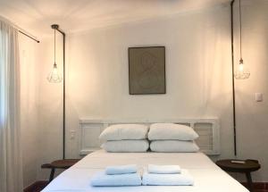 Postel nebo postele na pokoji v ubytování Hotel Boutique KAA
