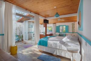 Llit o llits en una habitació de Pousada Loft da Serra
