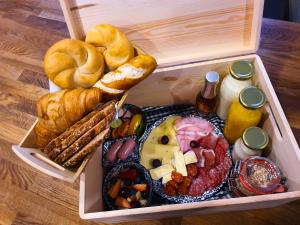 a lunch box filled with different types of food at Kozma Apartments Peterlewand in Bodensdorf