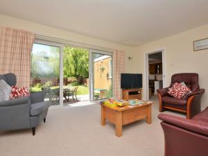 a living room with a couch and a coffee table at 4 Bed in Thirsk 49481 in Thirsk