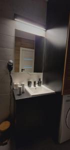 a bathroom with a sink and a mirror at Apartament z duszą in Kłodzko +17 photos
