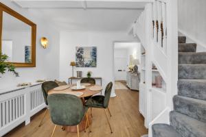 a dining room with a table and chairs at Charming Church Walk - 2 bedroom property with parking in Long Melford