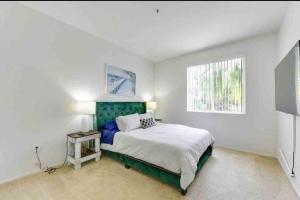 a bedroom with a large bed and a window at HubLife Your Private Oasis in the Heart of Marina del Rey in Los Angeles