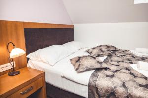 Postel nebo postele na pokoji v ubytování Etno selo Stanišići Hotel Leonida