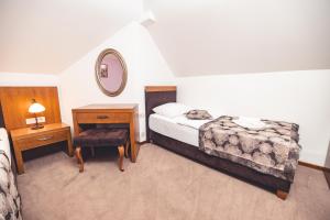 Postel nebo postele na pokoji v ubytování Etno selo Stanišići Hotel Leonida