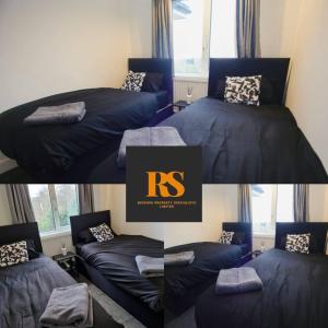 een kamer met 2 bedden, een bank en een raam bij Lovely 2 Bedroom House Sheffield Central Location in Sheffield