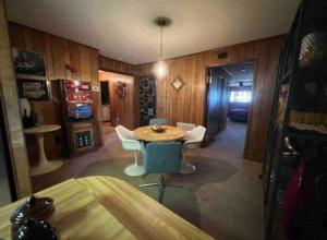 a room with a table and chairs in a room at Large 3 Bedroom 70's Home - Benton, AR in Benton