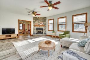 a living room with a couch and a fireplace at Elegant Pataskala Home with Hot Tub and Fire Pit! in Pataskala