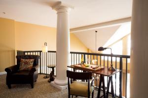 a balcony with a table and a chair at Wild Dunes Resort - Sweetgrass Inn and Boardwalk Inn in Isle of Palms