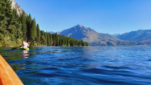 a person on a raft in the water on a lake at Patriada Ranch in El Hoyo