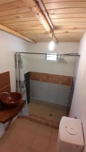 a bathroom with a toilet and a sink at Patriada Ranch in El Hoyo