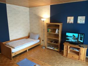 Кровать или кровати в номере Großes Apartment "Rena"