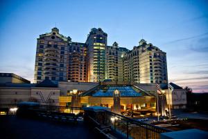 a large building with tall buildings in the background at TheGWMHouse 