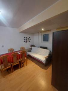 a bedroom with a bed and two chairs in it at Travel House Wrocław in Wrocław