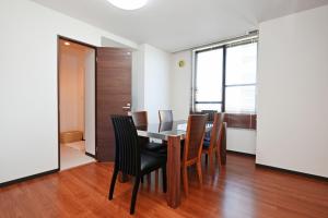 a dining room with a table and chairs at Pleasure Maruyama - Vacation STAY 52780v in Sapporo