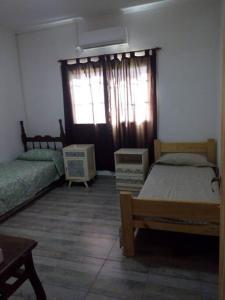 Un pat sau paturi într-o cameră la Casa - Dos habitaciones