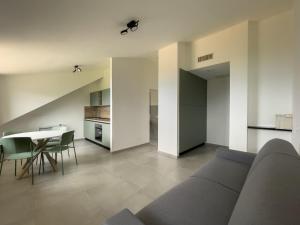 a living room with a couch and a table at Podere Belvedere in Moneglia