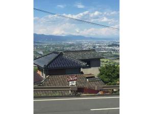 a house on the side of a road at Obasute Guesthouse Nakaraya - Vacation STAY 31596v in Chikuma