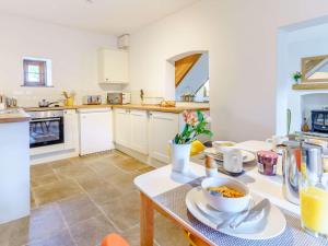 a kitchen with a table with food on it at 2 bed property in Nantyglo 82707 in Nantyglo