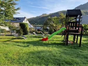 a group of playground equipment in a yard at Weingut im Moselkrampen in Ellenz-Poltersdorf