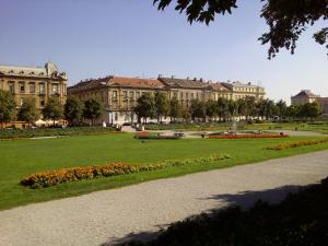 a park in front of a large building at ZagrebRent Apartments in Zagreb