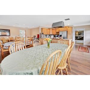 a dining room and kitchen with a table and chairs at 7 Point Ranch in Emigrant