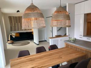 a kitchen and dining room with a table and chairs at Villa Mazzano in Riva del Garda