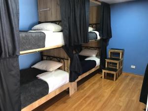 Postel nebo postele na pokoji v ubytování Golden Rest Latacunga