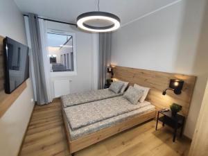 Ένα ή περισσότερα κρεβάτια σε δωμάτιο στο STARCO Apartamenty Centrum +23 φωτογραφίες