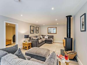 a living room with a couch and a fireplace at 3 Bed in Tollerton 87290 in Tollerton