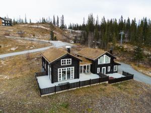 an aerial view of a house on a hill at Åre Valley Lodges - Grand Ski Lodge in Åre