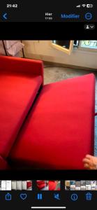 a close up of a red couch in a room at Cosy Appart Centre de Paris in Paris