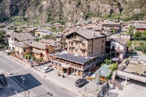 an overhead view of a town with a mountain at Hotel&Restaurant Armanac de Toubïe in Arnad