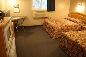 Ένα ή περισσότερα κρεβάτια σε δωμάτιο στο Lamplighter Inn