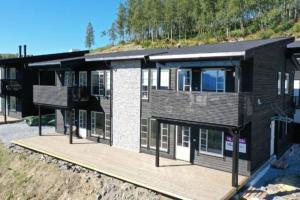 uma representação de uma casa com uma colina atrás dela em Leilighet - Panorama view - Sogndal Skisenter Hodlekve em Sogndal