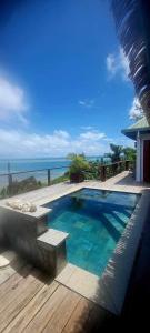 a swimming pool with a view of the ocean at Private Oceanfront Fijian Villa Sleeps 8 in Malolo