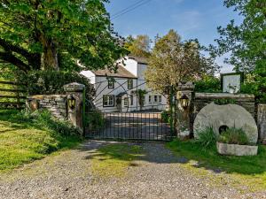 an old gate in front of a house at 3 Bed in Newlands Valley SZ508 in Braithwaite