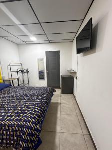 Μια τηλεόραση ή/και κέντρο ψυχαγωγίας στο Casa Mia 901SM, habitación 1