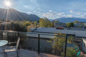 a balcony with a view of a mountain at Pip's Lakeview Retreat in Wanaka