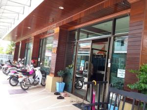 a group of motorcycles parked outside of a store at J Hotel2 in Ao Nang Beach