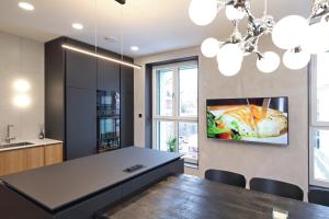 TV a/nebo společenská místnost v ubytování Apartmány Vila Terasy