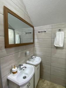 a bathroom with a sink and a mirror at Yugoslavija 2 centar in Aleksandrovac