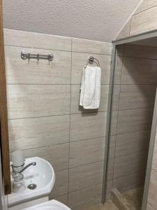 a bathroom with a shower and a toilet and a sink at Yugoslavija 2 centar in Aleksandrovac +24 photos