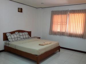 a bedroom with a bed with two towels on it at J Hotel2 in Ao Nang Beach
