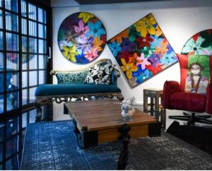 a living room with a couch and a coffee table at Art BeachFront Villa in Lefkada Town +40 photos