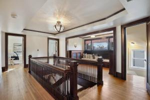 a room with a staircase and a living room at Luxury 6600 sq.ft Stunning Home/Sleeps 10+ in Minneapolis