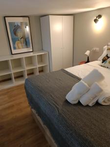 a bedroom with a bed with two pillows on it at Apartamento pacifico a in Madrid